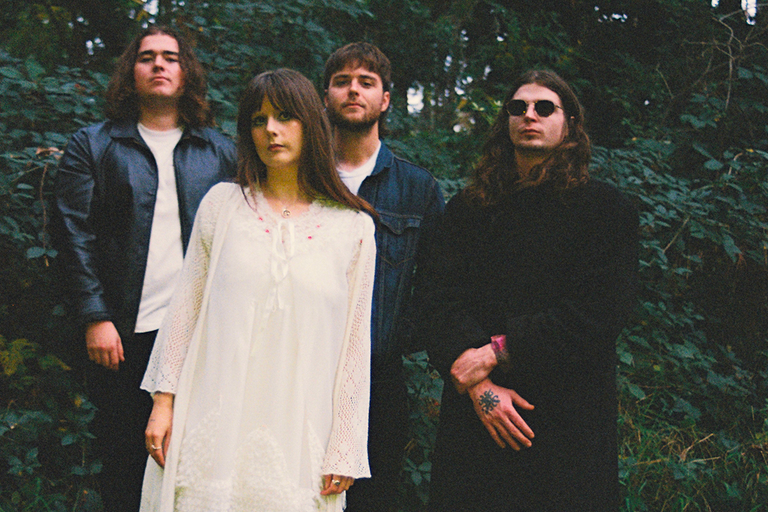 Adelaide band Oblivia Jean members posing together in a forest for a press photo captured by Lizzie Love.